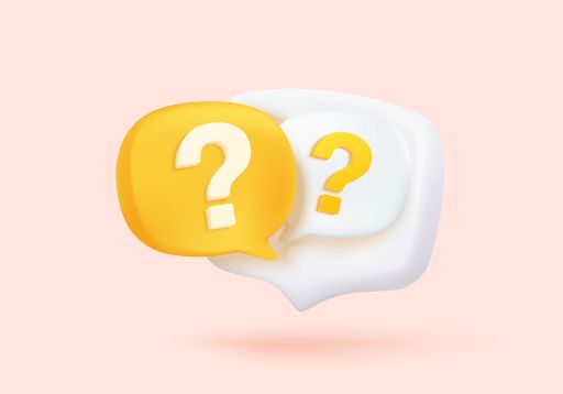 ピンクの背景の前に置かれた黄色と白のハテナマーク